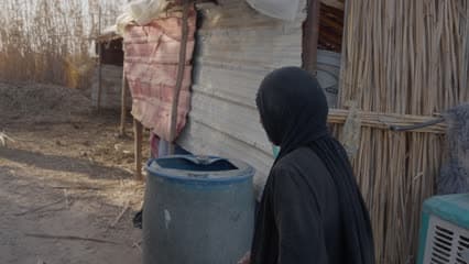The marshes of Al-Chibayish Marshes, an Iraqi woman