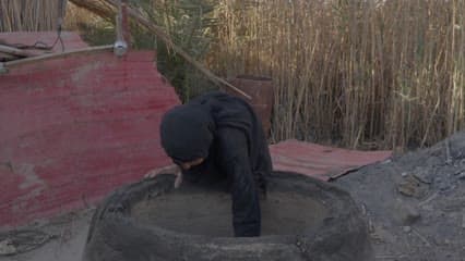 A clay tandoor oven, Iraqi bread, the marshes