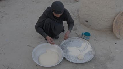 Preparing Iraqi bread, the marshes